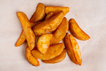 Rustic potato on a paper background. Top view.