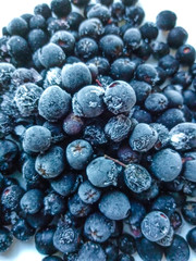 Fresh, sweet, large, healthy blueberries and chokeberry frozen.