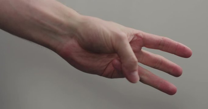 Slow motion man hand counting closeup