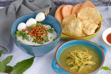Bubur ayam, Indonesian chicken rice porridge or congee with shredded chicken, fried soy beans, boiled quail egg skewer, celery, scallion, krupuk and emping.