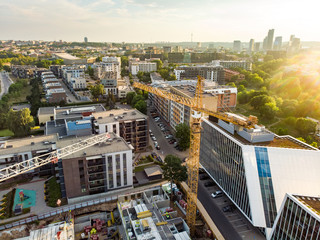 Fototapeta premium Aerial view of construction site in the city of Vilnius, Lithuania. Construction of apartment building in progress.