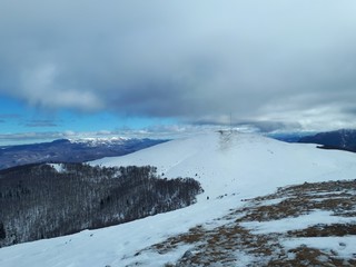 Fototapeta na wymiar Winter mountain landscape with clouds