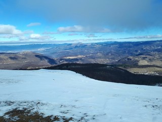 Winter mountain landscape with clouds