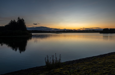 Fototapeta na wymiar Sunrise over Barcraigs Reservoir, Newton of Belltrees, Renfrewshire, Scotland