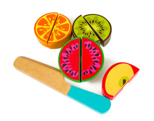 wooden toy fruits and knife