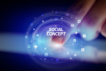 Finger touching tablet with social media icons and SOCIAL CONCEPT