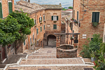 Corinaldo, Ancona, Marche, Italy: the long staircase in the downtown of the ancient village - 328674032