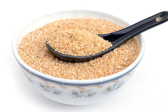 Bulgur (Daliya) in bowl, Bulgur wheat grains,  Raw cereal food, Dried cracked wheat.