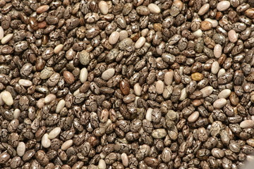 Mixed red, white and black quinoa as an abstract background texture