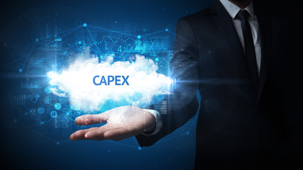 Hand of Businessman holding CAPEX inscription, successful business concept