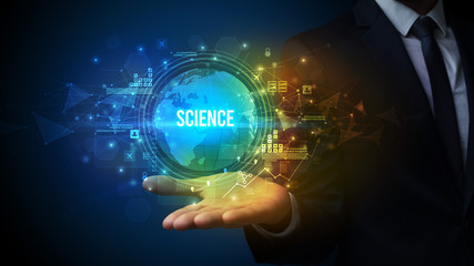 Fototapeta premium Elegant hand holding SCIENCE inscription, digital technology concept