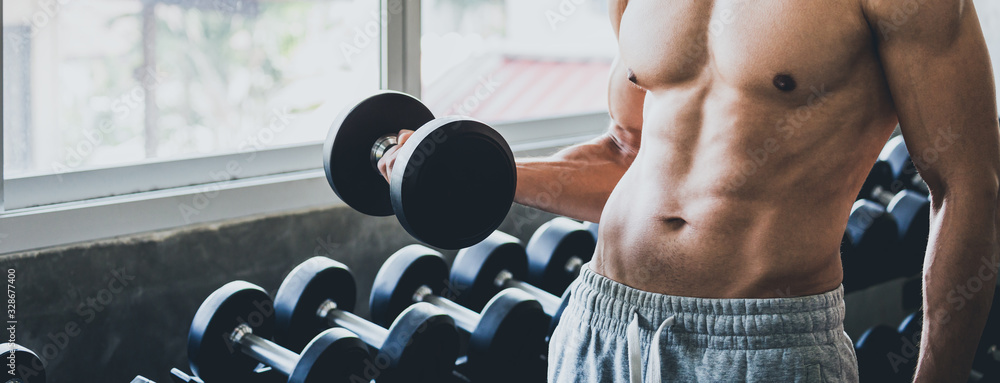 Wall mural fitness woman doing exercise in gym