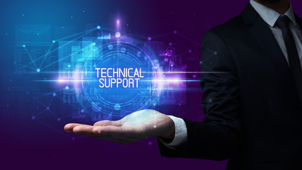 Man hand holding TECHNICAL SUPPORT inscription, technology concept