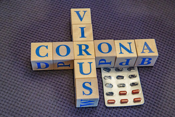 Wooden cubes with word Coronavirus in blue letters
