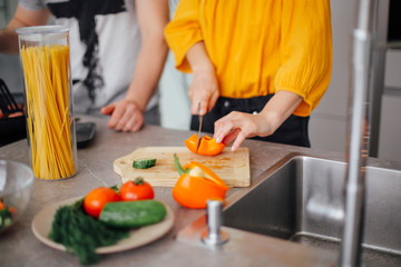 Ppeople cooking pasta. Happy family having spaghetti dinner