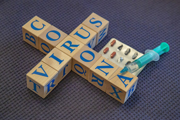 Wooden cubes with word Coronavirus in blue letters
