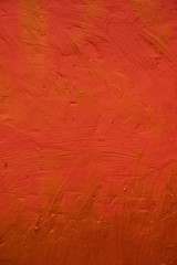 Textured red - yellow stone wall. Texture wallpaper.