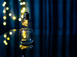 Bulb with reflection with a nice blurry bokeh effect. photography art, light bokeh, reflection,...