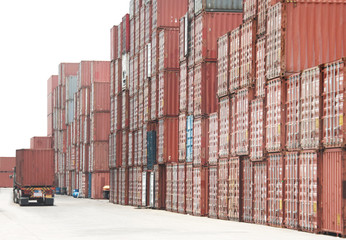 red iron container at cargo space in logistic