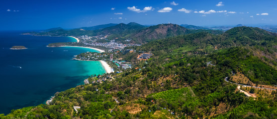 Aerial panorama of the coastline of the island of Phuket with tropical sandy beaches and green...