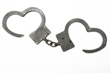 Steel handcuffs isolated on a white background