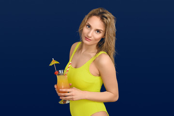 Attractive trendy blond woman with exotic cocktail