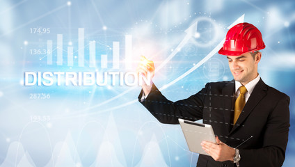 Young businessman with helmet drawing DISTRIBUTION inscription, modern business technology concept