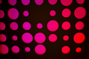 illuminated red and pink circles