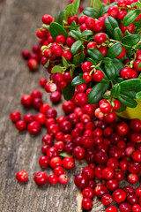 cowberries on wooden surface