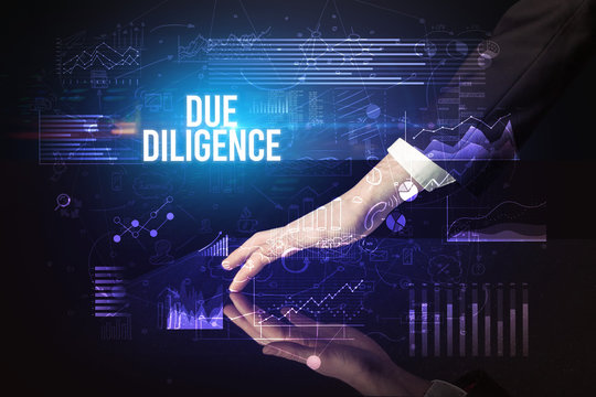 Businessman Touching Huge Screen With DUE DILIGENCE Inscription, Cyber Business Concept