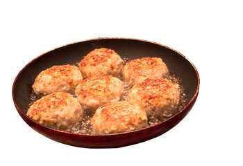 Cutlets in the process of cooking on a white background