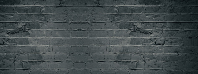 Dark black anthracite damaged rustic brick wall texture banner panorama	
