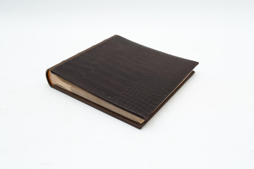 Leather  brown photo album on a white background