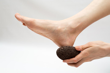 dry massage with a pumice stone.  foot care