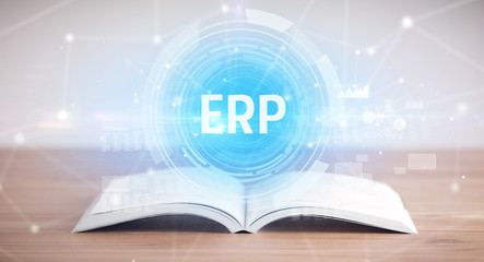 Open book with ERP abbreviation, modern technology concept