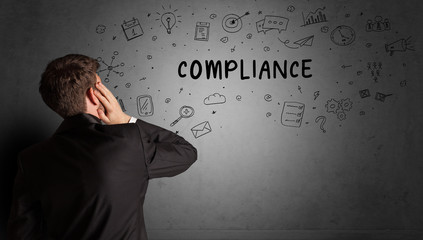 businessman drawing a creative idea sketch with COMPLIANCE inscription, business strategy concept