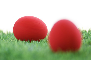 red easter egg on lawn green grass artificial with blank white background