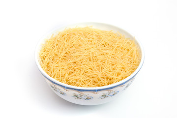 Vermicelli pasta in a wood bowl. white background