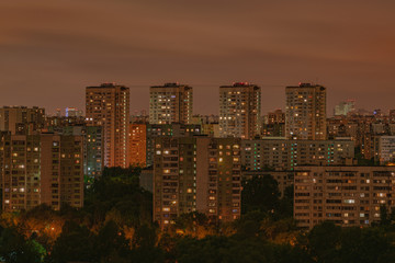 Moscow residential apartments night view, with bright orange lighting windows, Moscow, Russia