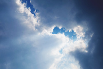 Beautiful white cloud with blue sky and sun light background texture.