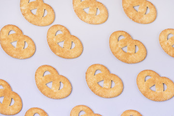 Sweet Small Pretzel on a Blue Background Top View Horizontal Pattern