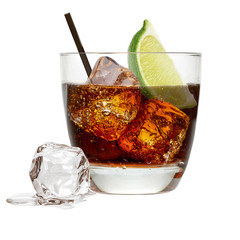 Vanilla vodka, rum or Cuba Libre with lime and cola in glass isolated on white background