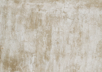Aged plaster with cracks. Weathered white, old whitewash, visible particles of brown sand. A high resolution. Quality background.