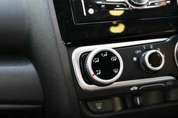 Detail with the air conditioning button inside a car.Control panel car air conditioner dashboard / console Technology in a modern car.Modern interior details.