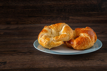 Two croissant on a plate