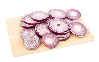 Sliced red onion rings on a wooden kitchen board