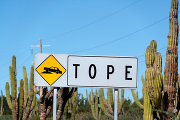mexico tope sign in english bump road sign