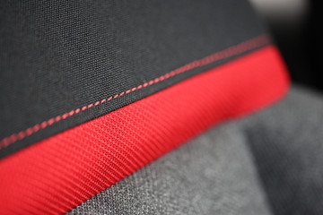 red stripe and stitching on fabric seat