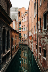 Obraz na płótnie Canvas View of the rustic architecture of Venice, Italy canal alley 