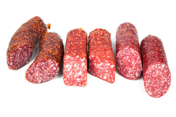 Smoked sausage in assortment on a white background